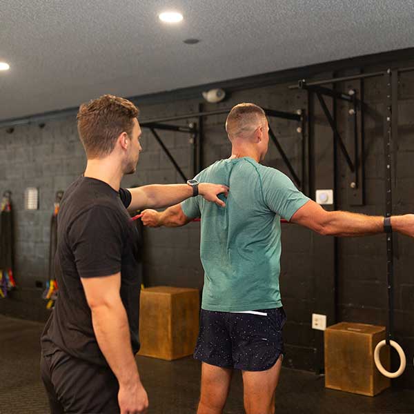 Coach showing how to exercise